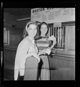 Two women in front of the Red Sox ticket window holding tickets for Barry Goldwater rally