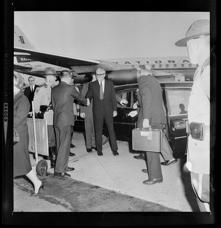 Presidential nominee Sen. Barry Goldwater shakes hands outside a limo at an airport