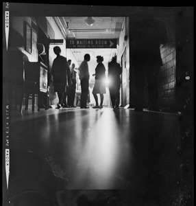 View of people gathered outside of a waiting room