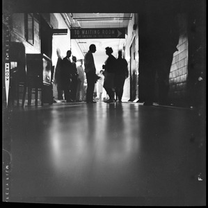 View of people gathered outside of a waiting room