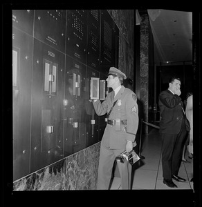 Security guard looking at a panel