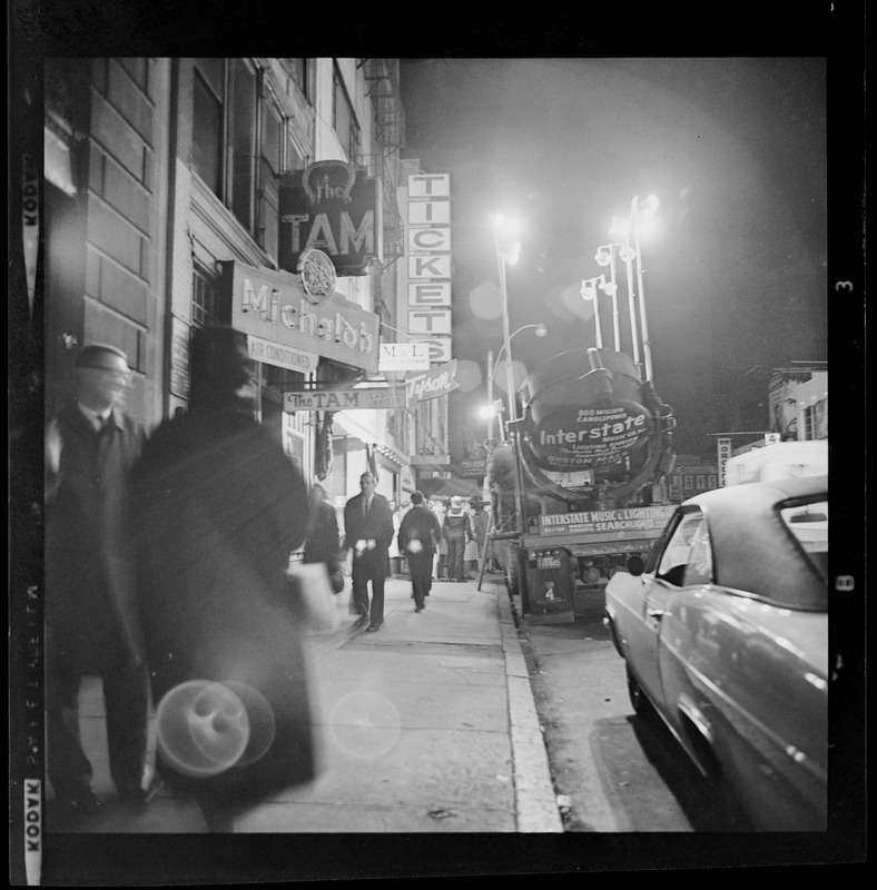 View of people walking sidewalk during the blackout