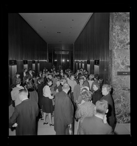 Group of people gathered in a building lobby