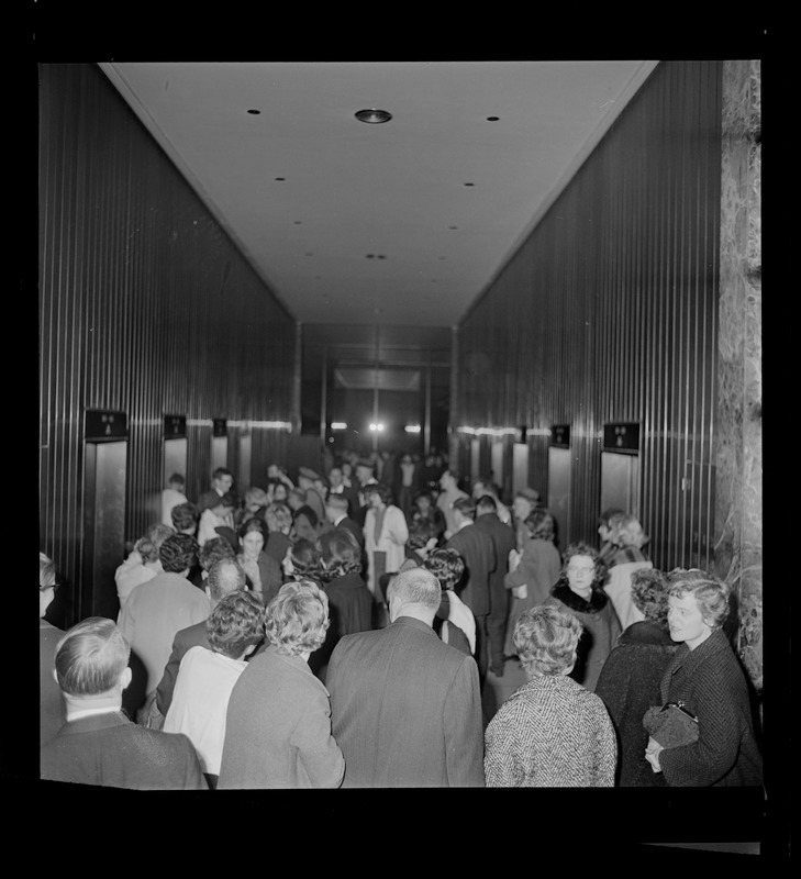 Group of people gathered in a building lobby