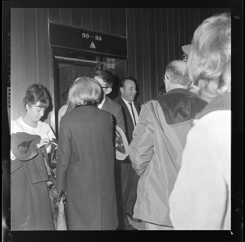 Group of people outside an elevator