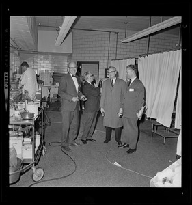 Group of four men in a hospital ward