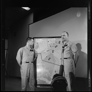 Two officers addressing an Air Force radar picket plane crash to reporters