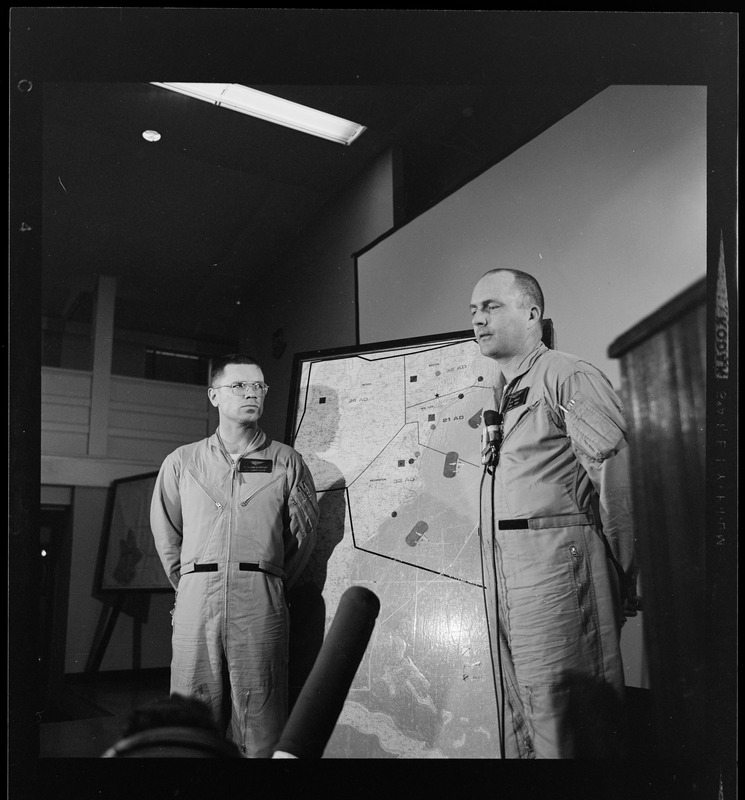 Two officers addressing an Air Force radar picket plane crash to reporters