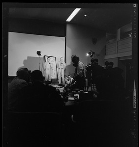 Two officers addressing an Air Force radar picket plane crash to reporters