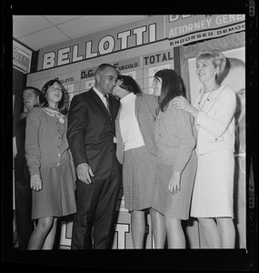 Former Lt. Gov. Francis Bellotti receives a kiss from a woman on stage after hearing his victory in the three way race for Democratic nomination for Attorney General