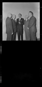 Billy Graham talking with five other men