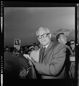 Sen. Barry Goldwater's face is reflected in the roof of the car that carried him from Logan Airport to the Ritz Carlton Hotel