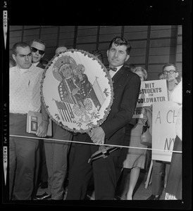 Josef Mlot-Mroz holding a "Freedom for Poland" sign at the airport as Sen. Barry Goldwater arrives