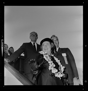 Sen. Barry Goldwater, Peggy Goldwater and Lloyd Waring, N.E. Goldwater Committee Coordinator, exit the airplane