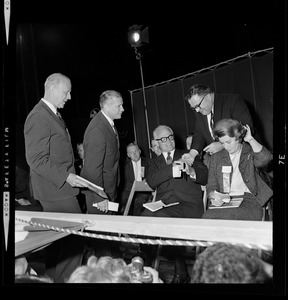 Sen. Barry Goldwater sitting with his wife Peggy and others on the stage at Fenway Park