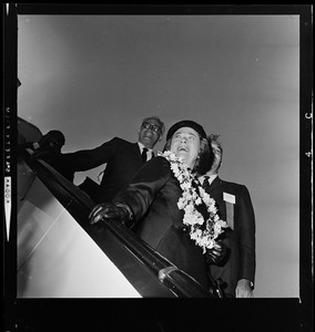 Peggy Goldwater exiting the plane with others