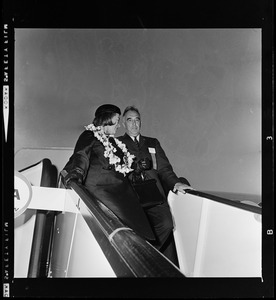 Peggy Goldwater and Lloyd Waring, N.E. Goldwater Committee Coordinator, exiting airplane