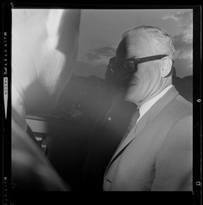 Sen. Barry Goldwater talks with a man after landing in Boston