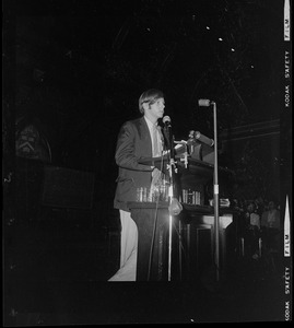 Man addressing Harvard students at Sanders Theater at a Moratorium Day rally