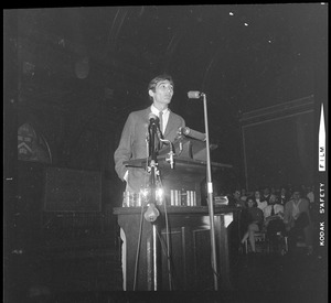 Man addressing Harvard students at Sanders Theater at a Moratorium Day rally