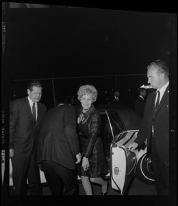 Patricia Nixon exiting a vehicle