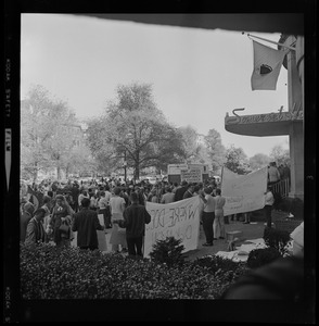 Protesters gathered with signs outside of the Somerset Hotel