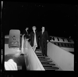 Mr. and Mrs. Nixon leaving a United flight after landing in Boston