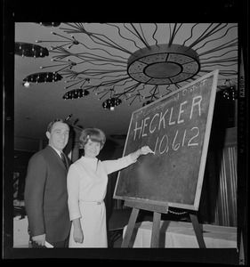 Margaret Heckler and husband John with the votes tally board