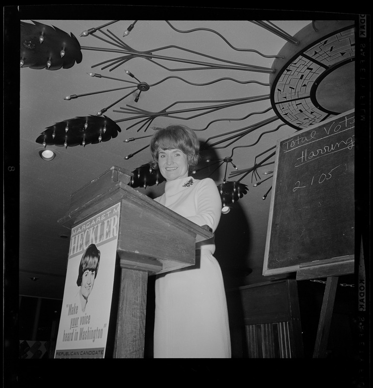 Margaret Heckler at the podium addressing the room