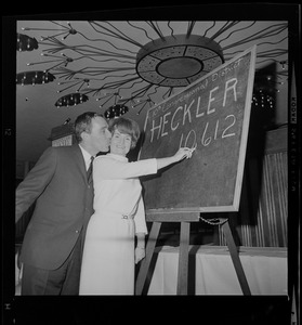 Margaret Heckler and husband John with the votes tally board