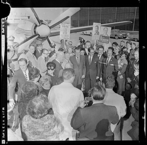 Republican candidate for Governor John A. Volpe, former Vice President Richard Nixon, Republican candidate for Lt. Governor Eliot Richardson, and Republican Senate candidate Howard J. Whitmore surrounded by group of reporters and supporters outside of the airport