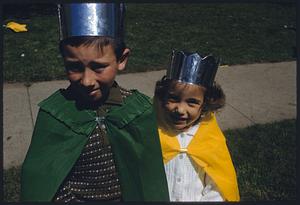 Boy and girl wearing costumes with capes and crowns, Somerville, Massachusetts