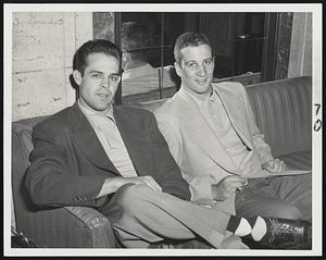 Left Side of the Cleveland Indians' Infield is taken care of by Shortstop Ray Boone (left) and Third Baseman Al Rosen shown as they relaxed at the Hotel Kenmore before today's game with he Red Sox at Fenway Park.