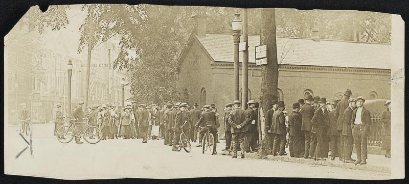 Awaiting Next Move in Mill Strike Pay Demand. A group of strikers at the entrance to the tremont & Suffolk mills. Although thousands went on strike today, there was no disorder whatever. The strikers did not congregate about the mills – in fact, the group pictured above is one of the largest seen this morning at any mill.