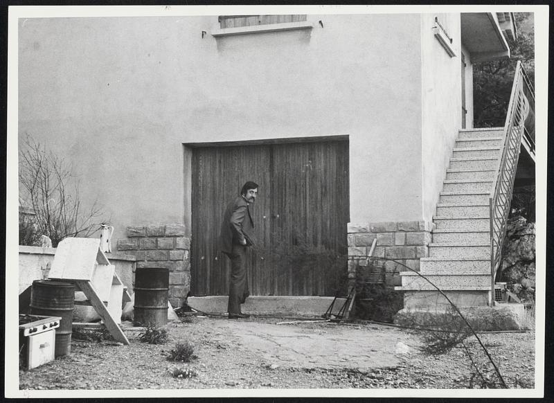 Drug Factory This seemingly innocuous villa near Marseilles, France, was found to house a heroin processing laboratory. AP reporter Bernard Gavzer stands at a sealed entrance to the house - the undercover agents involved in the case were not willing to be photographed. The most expert processers in the world operate round Marseilles, and agents of the U.S. Bureau of Narcotics and Dangerous Drugs are trying to clamp down on drug trafficking at this processing stage, before the heroin gets sent on its way - to the U.S.