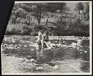 Down To Rock Bottom. Chichester, N.Y. -- Little Eddie Lee and Richard Tobias mournfully view the mere trickle that represents the once swift-flowing bushkill creek near here, as a result of the prolonged drought. What's the use of wearing bathing suits, they declare, when all you can wet is your toes.