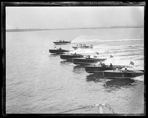 A group of speed boats in the water