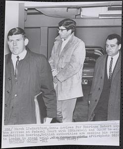 Arrives for hearing