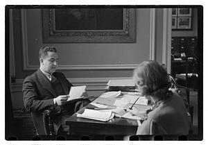 A man seated at a desk