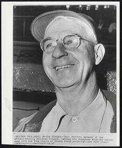 Tha Winnah--Burt Shotton, manager of the pennant-winning Brooklyn Dodgers, watches his champions work out before game with New York Giants at Ebbets field yesterday.