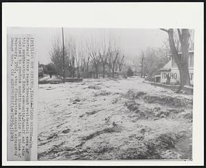 Lava Hot Springs, Idaho -- Flood Waters -- The Portneuf River rages through residential area of this southeastern Idaho community. Runoff and rain combined to produce conditions similar to those of February, 1962, when floodwaters caused extensive damage here.