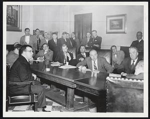 City Council Hears From Guards of the Charles street jail, who aired their grievances at yesterday's council meeting. The councilmen shown are, clockwise from left: Hailer, Piemonte (chin on hand), McCormack, Ahern, Foley and Kerrigan. The group standing in the rear is the jail guards' delegation.