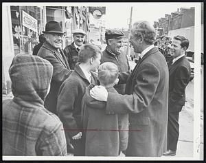 Evacuation Day Research was conducted in South Boston yesterday by Mayor White, shown on Broadway. Afterward, he announced the March 17 parade would be held over entire route, and not shortened because of snow conditions.