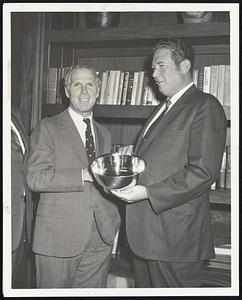 Mayor Kevin H. White of Boston today presented a Paul Revere bowl to Captain Edward J. Keelan of the Ancient and Honorable Artillery Company of Keelan, a resident of Dedham, will head a 300-man detail of Ancients to England this coming Friday when they board the Queen Elizabeth Two at Commonwealth Pier in South Boston. The bowl, presented by Mayor White, will be presented by Captain Keelan to the Honourable Artillery Company of London under the command of General Sit Rodney Moore. Queen Elizabeth will receive the entire Ancients Company at Buckingham Pallace at 12:00 noon on Thursday, October 7, 1971. Captain Keelan will present Her Royal Highness with a silver tea set, a gift from the Ancients. The Ancients and Honorable Artillery Company of Massachusetts, the oldest military organization in the United States, was chartered in 1638 and historic Faneuil Hall is their headquarters.