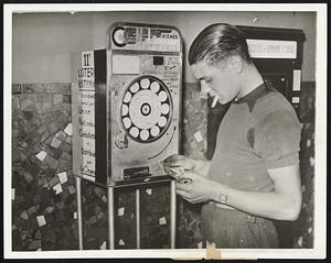 The Wheels of Chance are Streamlined. Appearing much like a modern cigarette vending machine, this automatic ticket distributer has been placed in use in the French national lottery. A customer is shown Aug. 25 obtaining a ticket from the device in Paris.