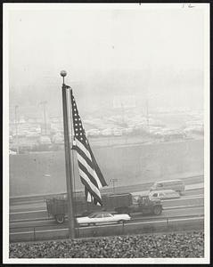 Fog Limited visibility to almost across the Massachusetts Turnpike from Albany street and not a whisper of a breeze moved the flag.