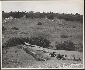 Leathernecks of the NOB rifle team are shown here practice firing for the coming match with the British