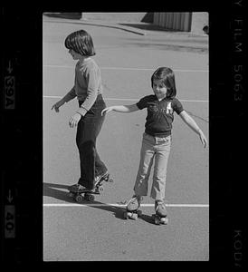 Suzanne Daley has a skating lesson from sister Amy, Needham