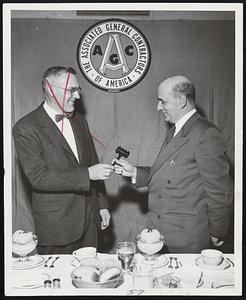 Mr. Stanley D. Porter of the William H. Porter Company, President of the Associated General Contractors of Mass., Inc. turns the gavel over to President-Elect Julius Abrams of the Poley-Abrams Corp., Brookline, at the Annual Dinner Meeting of the Association held Wednesday night (December 16, 1953) at Hotel Kenmore in Boston. Other incoming officers were Thomas Mulcare, Vice-President, John Logue, Treasurer and Arthur Monohon, Secretary.