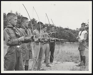 Scout Sharpshooters -- These Greater Boston Boy Scouts tried their hand at archery at the opening of the Loon Pond Camp at Lakeville. Left to right, they are Paul Doyle, Hillary MacConaill, both of Brighton; Charles McVey of the Back Bay; and Francis Cassidy and Paul O’Leary, both of Brighton. At far right is Robert Fletcher of Milton, instructor.